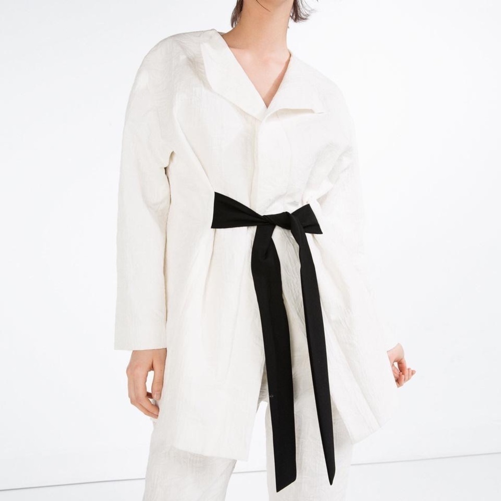 Elegant White Jacket with Black Tie
